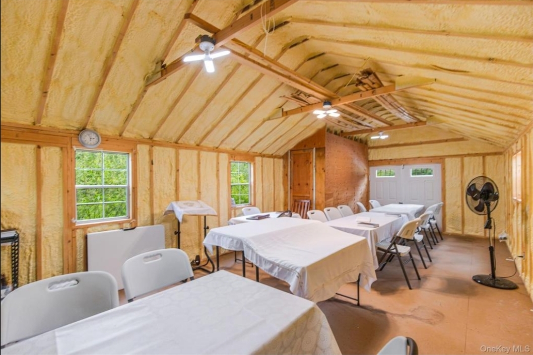 Cathedral cedar-beamed dining and Simcha hall seating 30+ guests